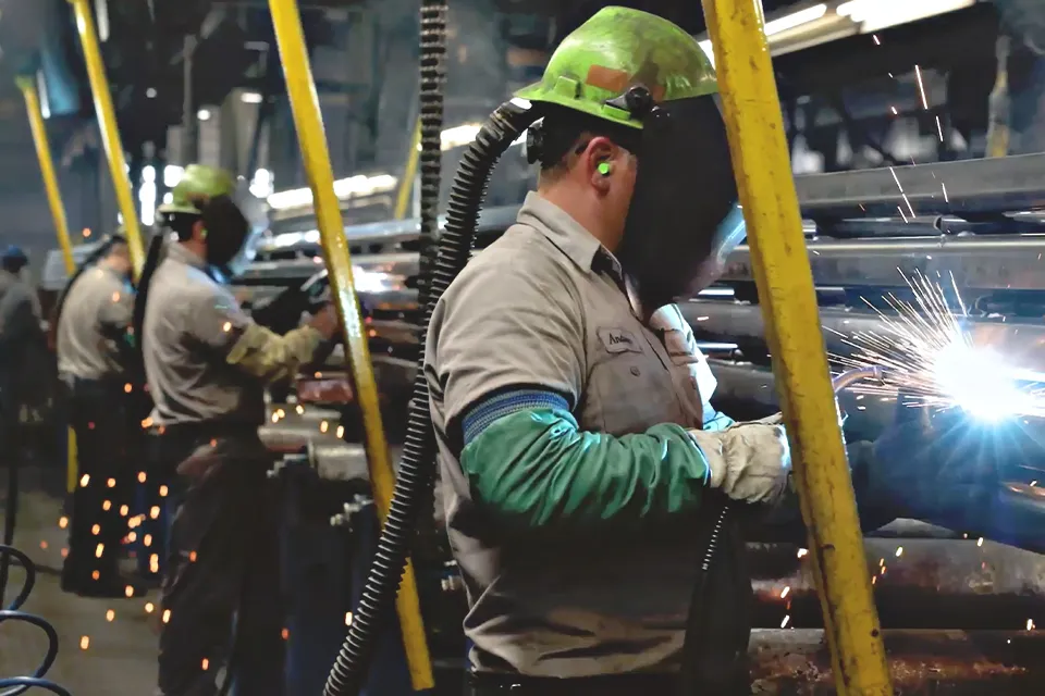 Welders on the steel joist production line