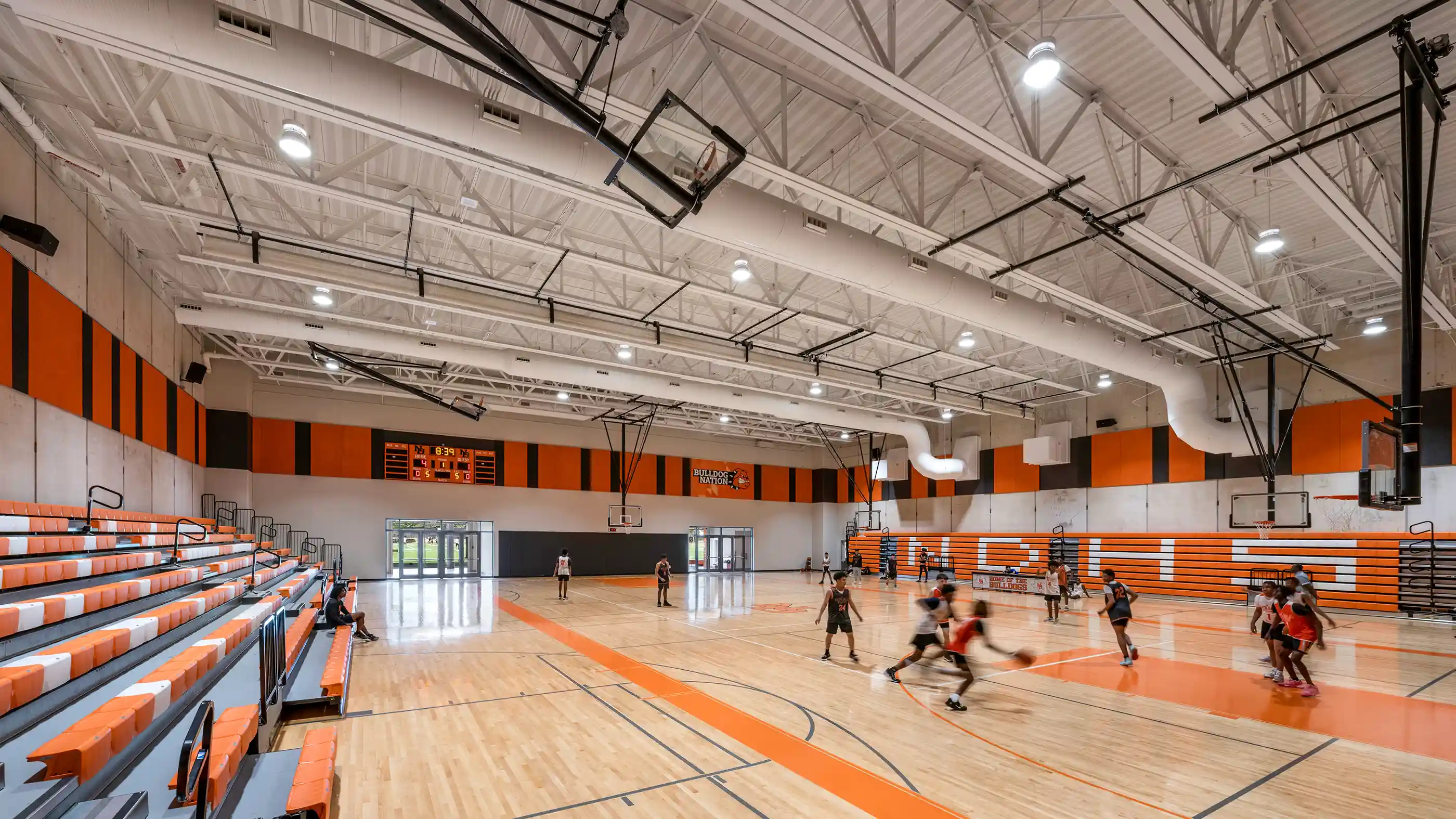 High school gymnasium and storm shelter with composite joists