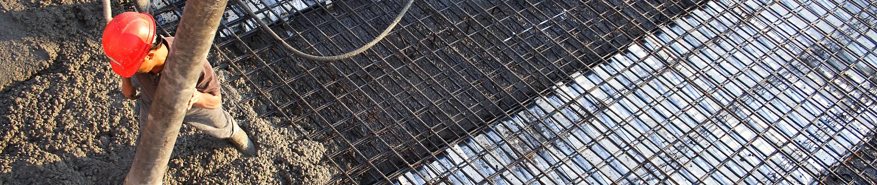 Close up of matching rebar and concrete pour