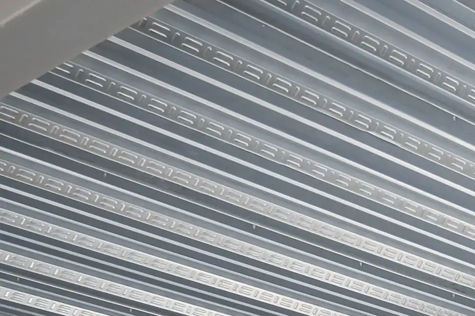 Standard Composite Floor Deck close up embossments in the vertical ribs